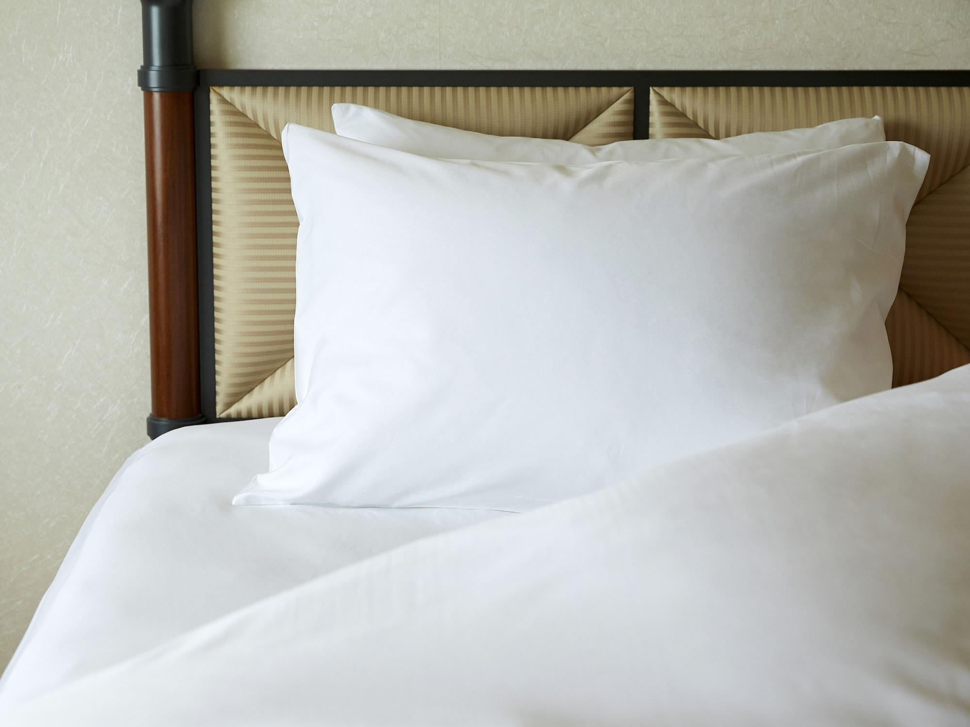 미야코 호텔 기후 나가라가와 외부 사진 A pillow on a bed